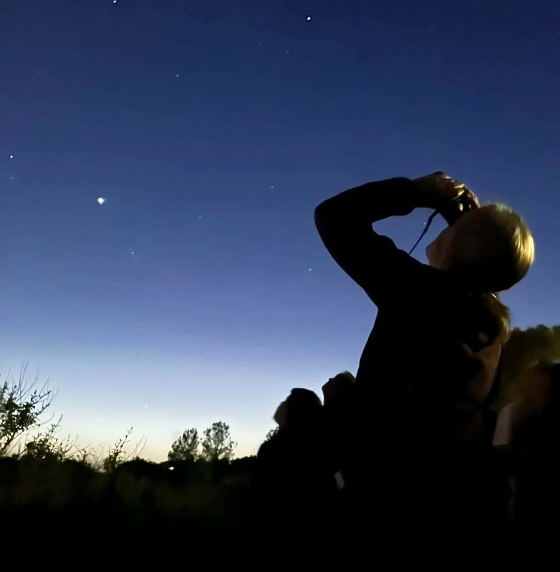 Stargazing with binoculars at dusk